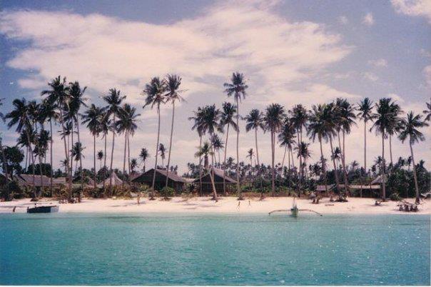 Tall trees and humble nipa huts on Old Boracay White Beach 1980s